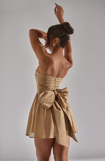 Nora - Robe bustier courte à paillettes dorées